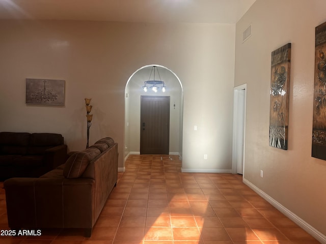 25722 S 179th St, Queen Creek, AZ 85142 - living area featuring light tile patterned floors, baseboards, and arched walkways