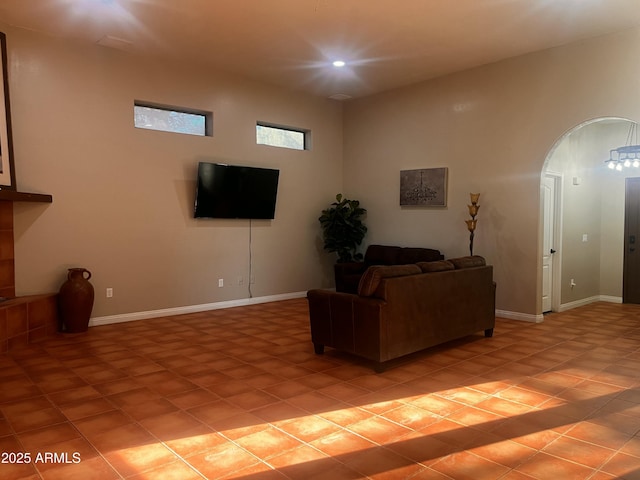 25722 S 179th St, Queen Creek, AZ 85142 - living area featuring light tile patterned floors, baseboards, and arched walkways