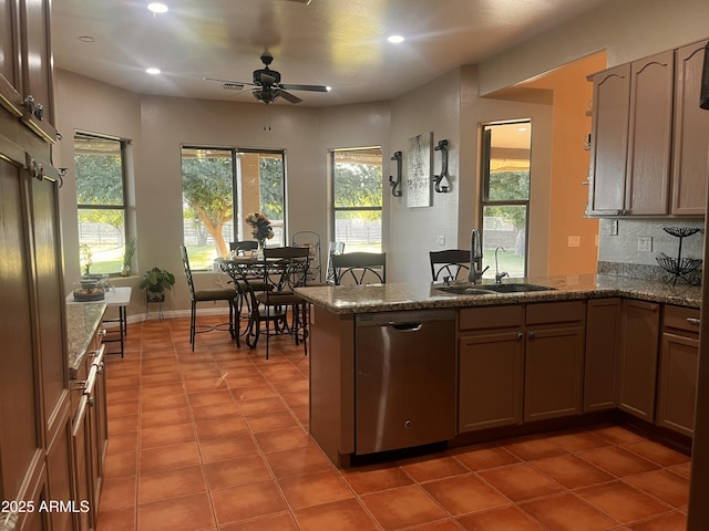 25722 S 179th St, Queen Creek, AZ 85142 - kitchen featuring stainless steel dishwasher, a sink, a peninsula, a ceiling fan, and plenty of natural light