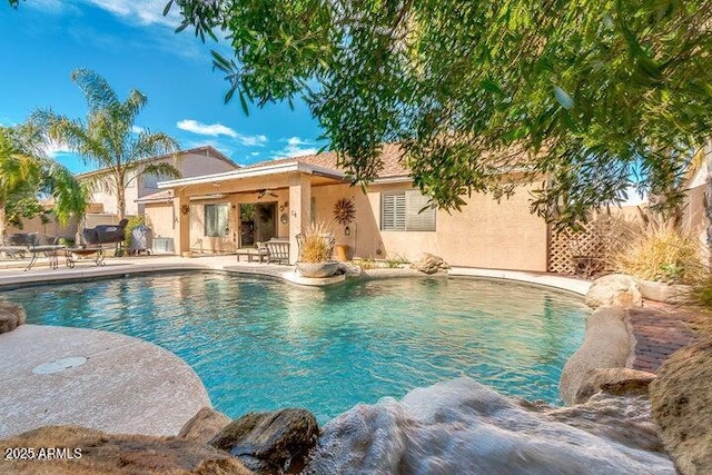 view of swimming pool featuring a patio area