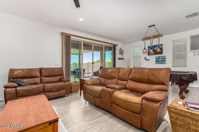 living room featuring pool table and light hardwood / wood-style flooring