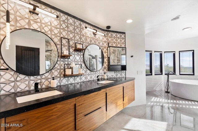 bathroom with a bathtub and vanity