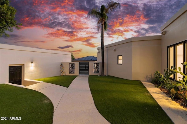 view of front of property with a yard