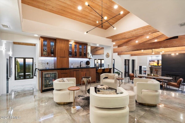 living room with indoor wet bar, high vaulted ceiling, beverage cooler, and wooden ceiling