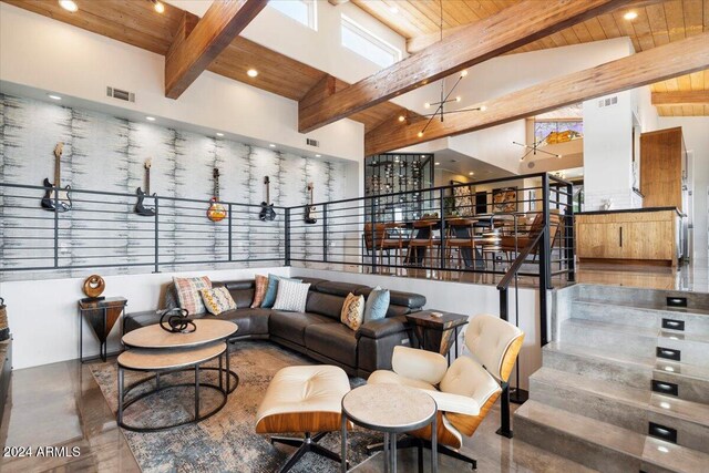 living room with a chandelier, wood ceiling, high vaulted ceiling, and beamed ceiling