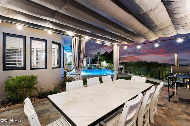 view of patio / terrace with a fenced in pool