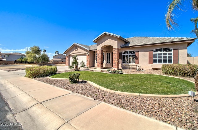 view of front of house featuring driveway, an attached garage, stucco siding, a front lawn, and a tiled roof