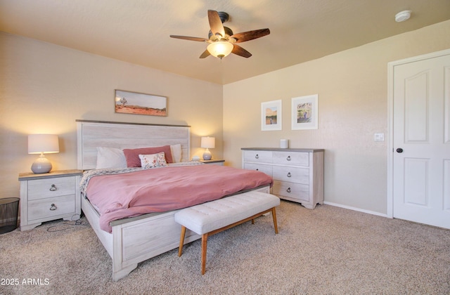 bedroom with a ceiling fan, light colored carpet, and baseboards