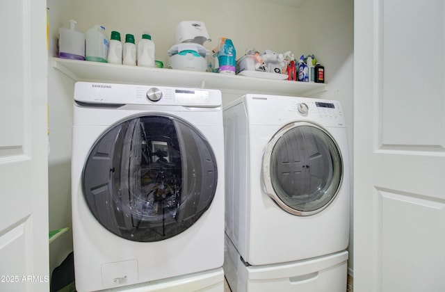 laundry area featuring laundry area and washing machine and clothes dryer