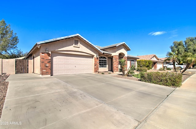 ranch-style house with a gate, brick siding, a garage, and driveway