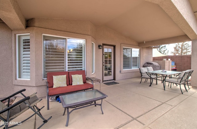 view of patio / terrace with outdoor dining area and fence