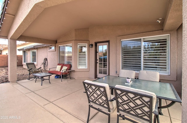 view of patio / terrace featuring outdoor dining space and fence