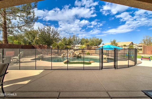 view of pool featuring a patio area, a fenced in pool, and fence