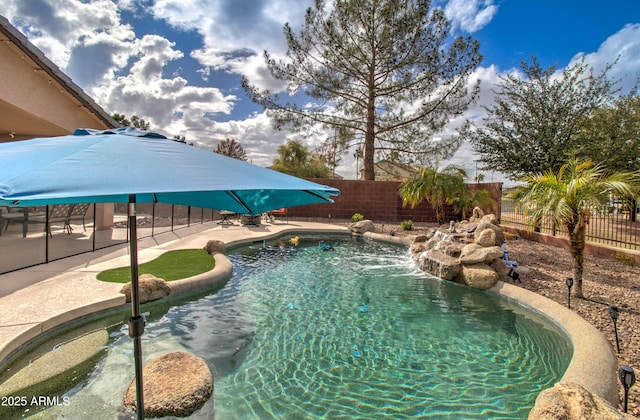 view of pool with a patio area, a fenced in pool, and a fenced backyard