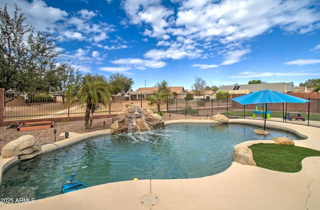 view of pool with a patio area, a fenced in pool, and fence