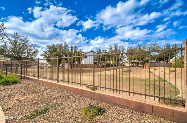 view of community with fence