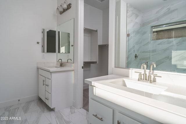 bathroom with a shower with door and vanity