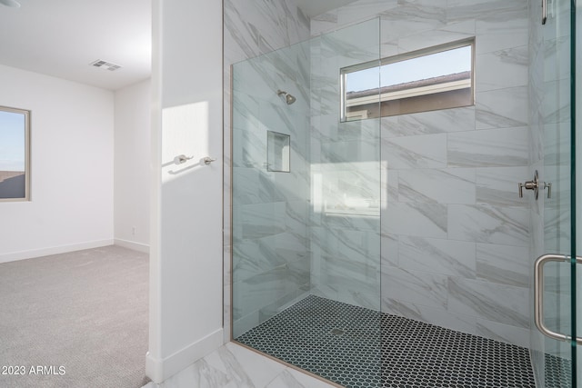 bathroom featuring an enclosed shower