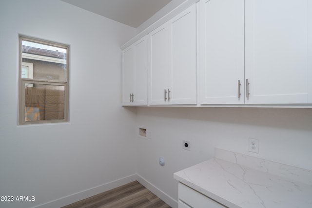 laundry area featuring washer hookup, hardwood / wood-style floors, cabinets, and hookup for an electric dryer