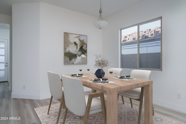 dining area with light hardwood / wood-style floors