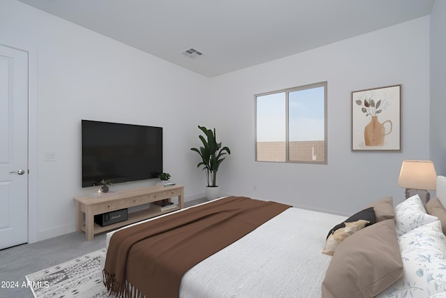 bedroom with light colored carpet