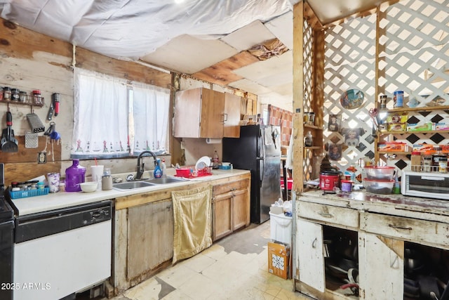 kitchen featuring brown cabinets, light countertops, a sink, and dishwasher