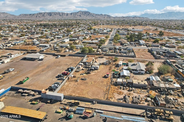 birds eye view of property featuring a mountain view