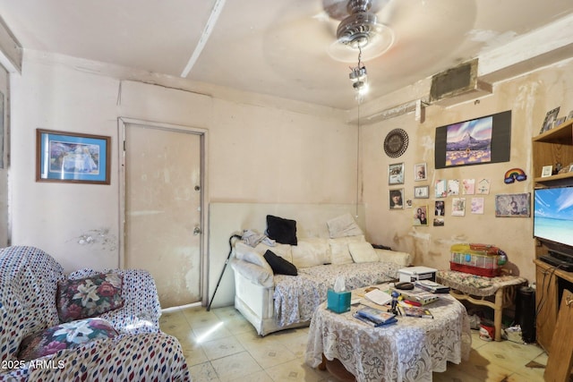 living area with a ceiling fan