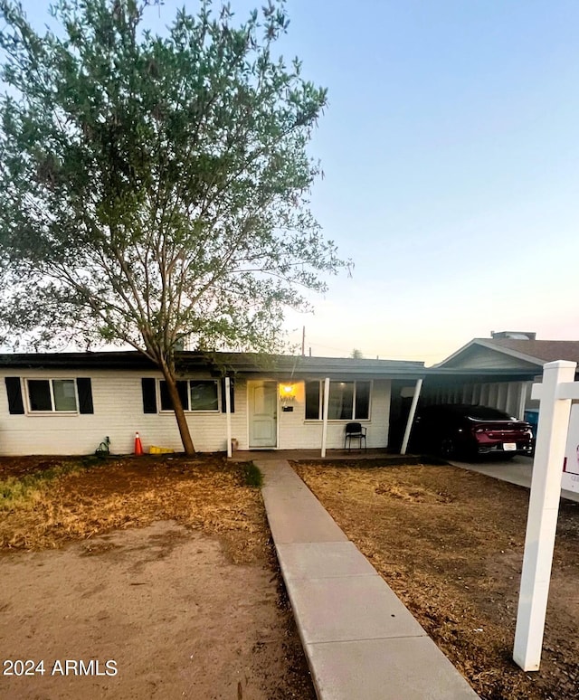 view of front of house with a carport