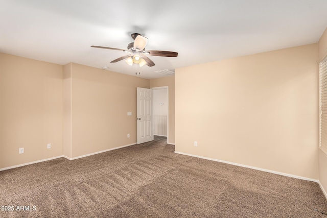 empty room featuring ceiling fan and carpet flooring