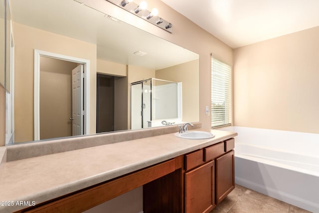 bathroom featuring independent shower and bath, vanity, and tile patterned floors