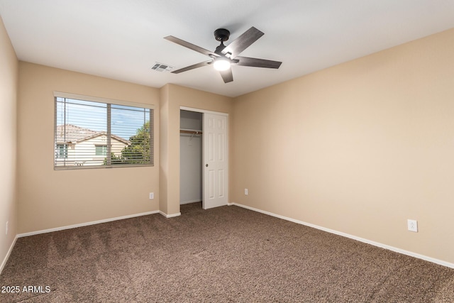 unfurnished bedroom featuring a closet, ceiling fan, and carpet flooring