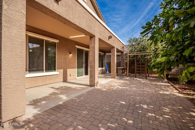 view of patio featuring a pergola