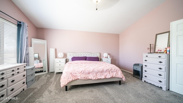 carpeted bedroom with vaulted ceiling