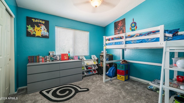 bedroom with carpet, a closet, and ceiling fan