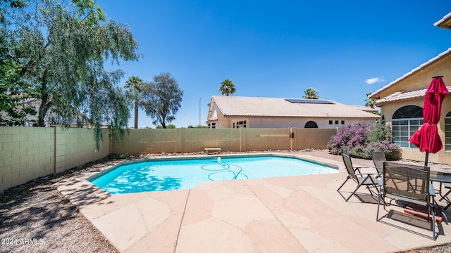 view of swimming pool featuring a patio area