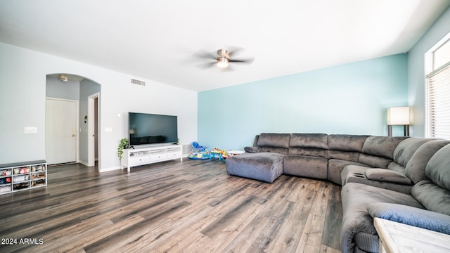 living room with ceiling fan and hardwood / wood-style flooring