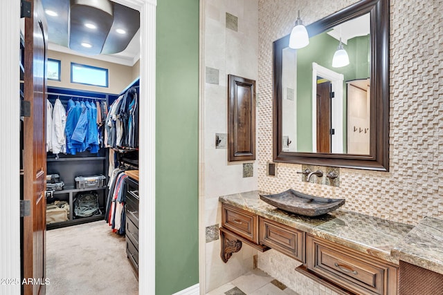 2371 E Sanoque Ct, Gilbert, AZ 85298 - full bathroom featuring vanity, a spacious closet, ornamental molding, and backsplash