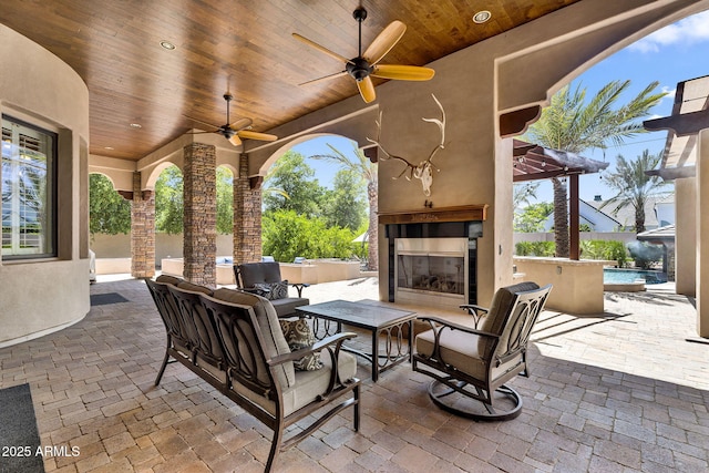 2371 E Sanoque Ct, Gilbert, AZ 85298 - view of patio featuring ceiling fan and an outdoor living space with a fireplace