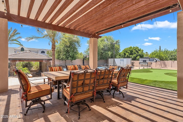2371 E Sanoque Ct, Gilbert, AZ 85298 - fenced backyard featuring a putting area, outdoor dining space, a patio area, and a gazebo