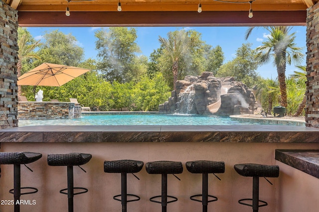 2371 E Sanoque Ct, Gilbert, AZ 85298 - outdoor pool featuring a bar and view of wooded area