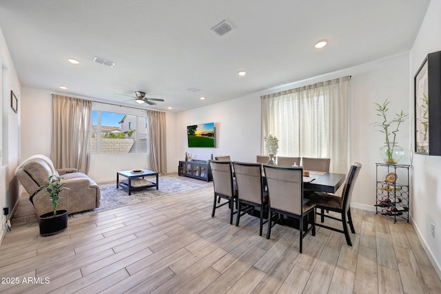 dining area with recessed lighting, visible vents, and light wood-style floors