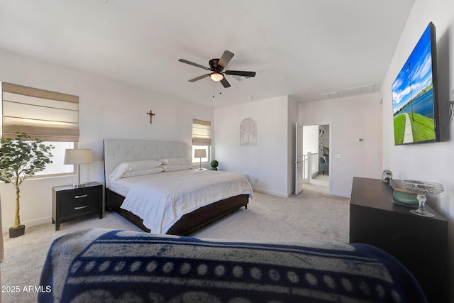 carpeted bedroom featuring baseboards and ceiling fan