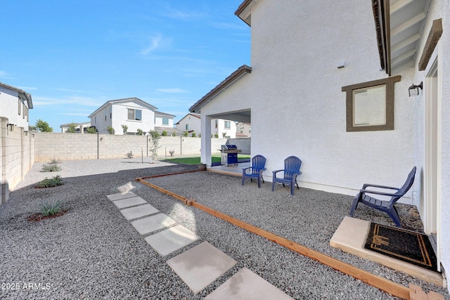 view of yard with a patio and a fenced backyard