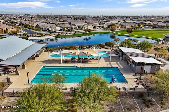 view of pool featuring a water view