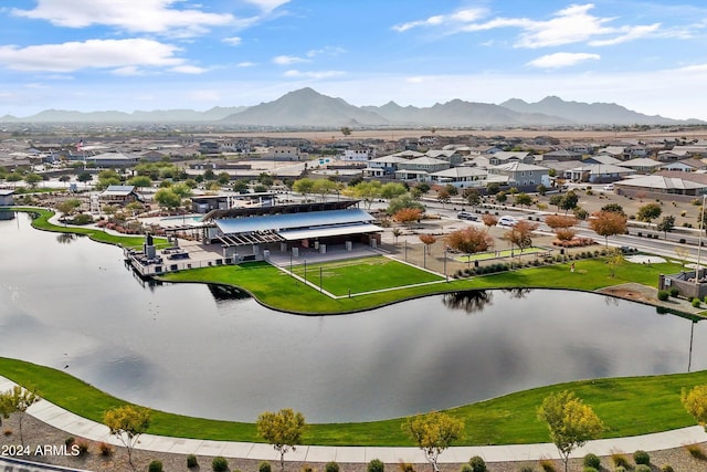 drone / aerial view with a water and mountain view