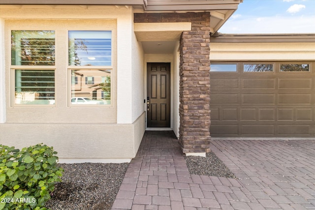 property entrance with a garage