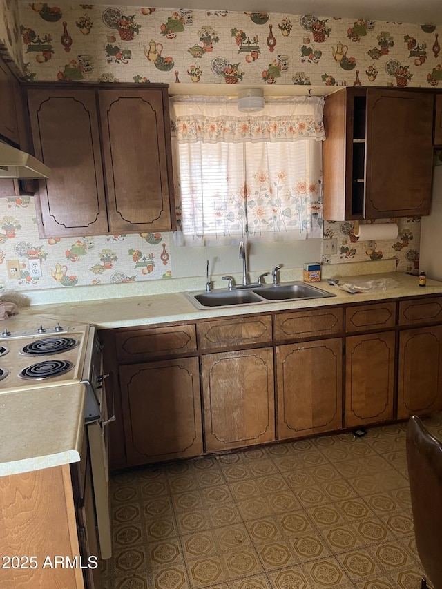 1346 S Main Dr, Apache Junction, AZ 85120 - kitchen with electric range oven, light countertops, and wallpapered walls