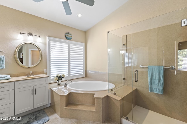 full bath with a stall shower, tile patterned floors, a bath, and vanity