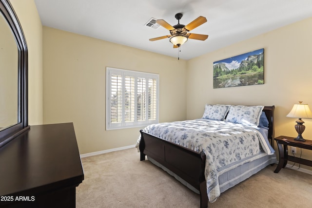 bedroom with light carpet, baseboards, visible vents, and a ceiling fan